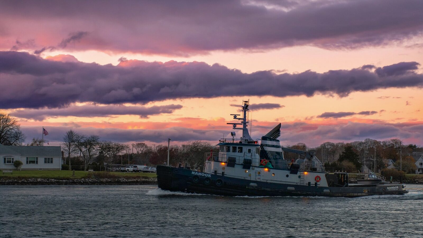 A vessel in the Cape Cod Canal at sunset