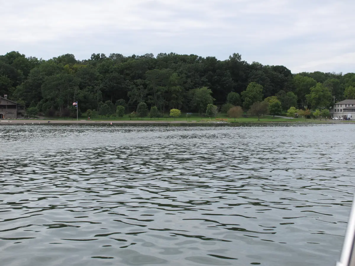 Cayuga Lake State Park shoreline, lawn and buildings viewed from the water