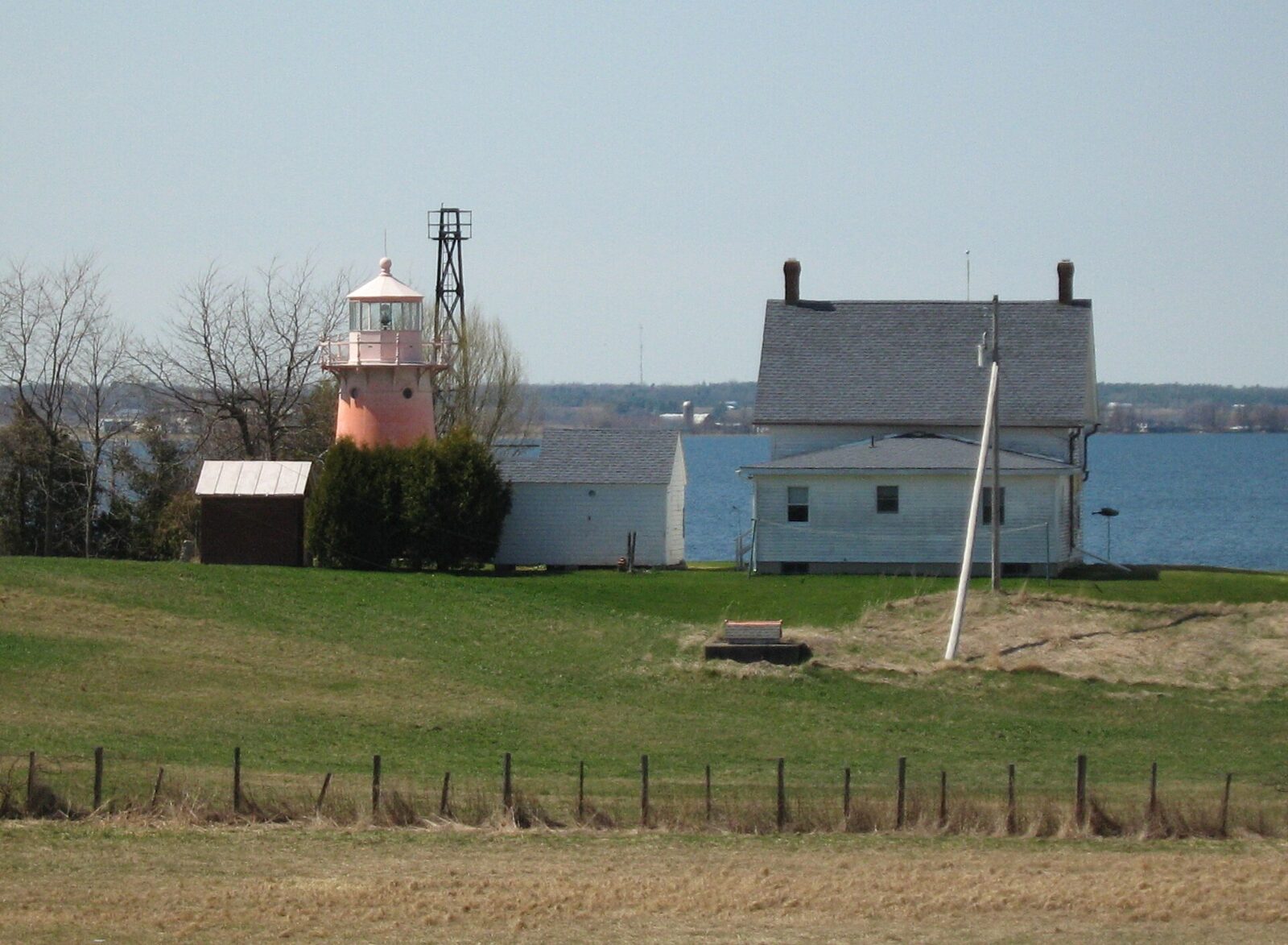 Lake Champlain lighthouse framed by mountain scenery