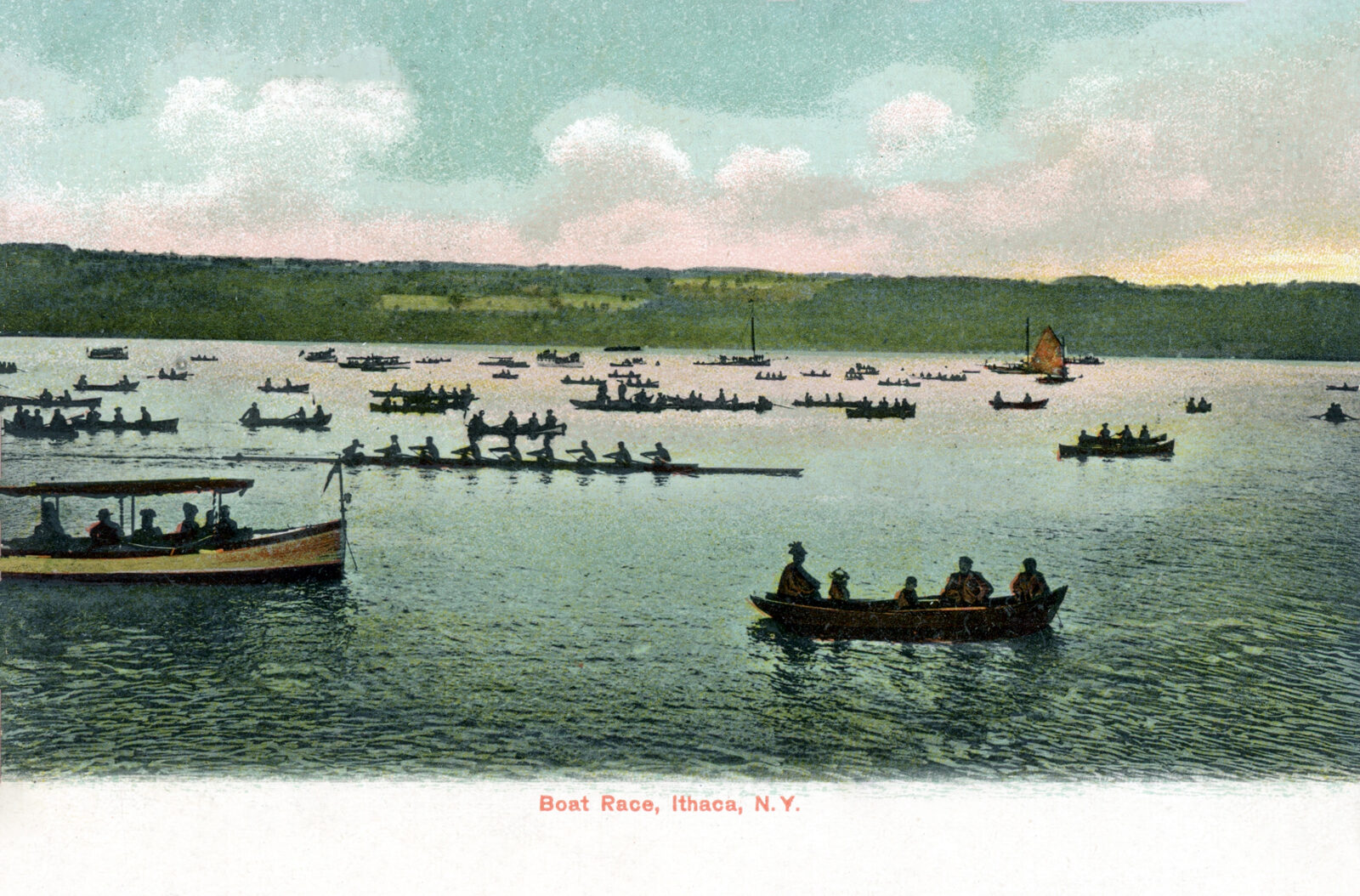 Boats on Cayuga Lake with a long shoreline beyond