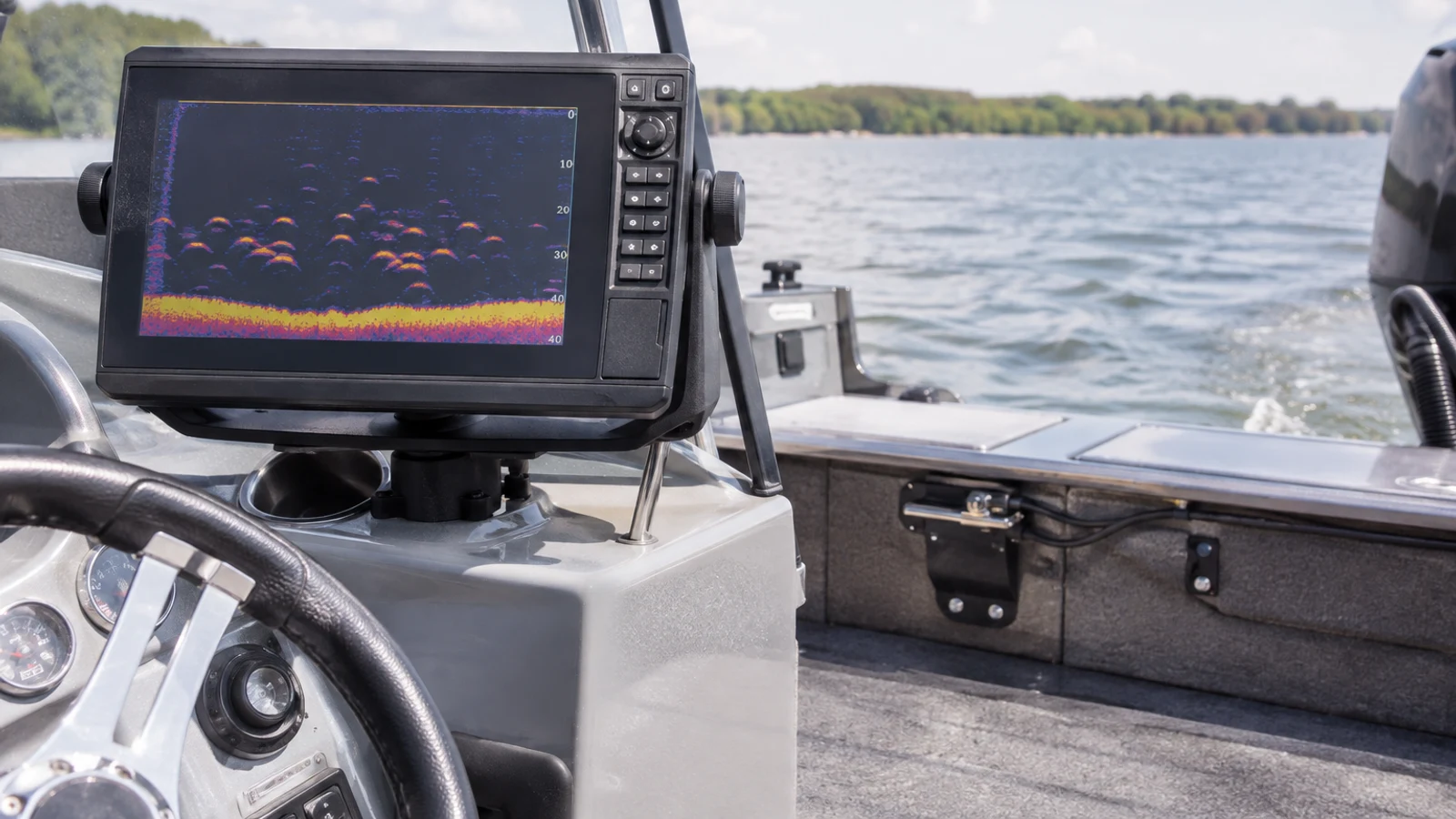 Unbranded fish-finder display showing a generic sonar return at a small fishing-boat helm