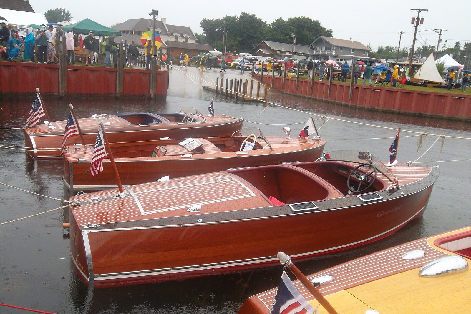 Restored wooden runabouts at an antique boat show