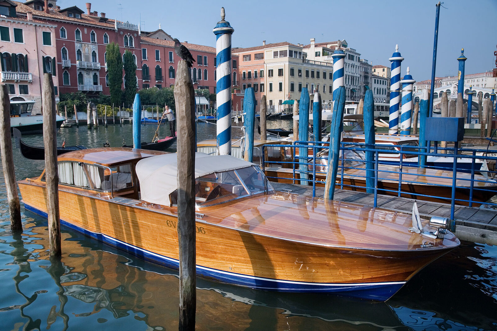 A varnished wooden motorboat showing polished deck and classic hardware
